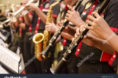 stock-photo-flute-trumpet-and-saxophones-orchestra-perform-by-high-school-boy-680296462